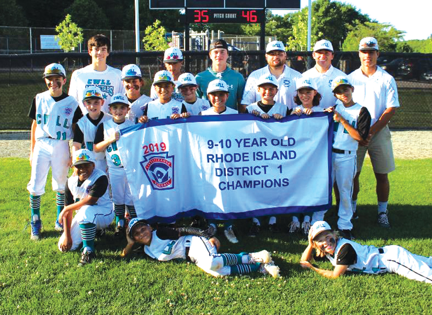 BIG STAGE: The Cranston Western 10’s celebrate after winning the District I title over North Providence last week.