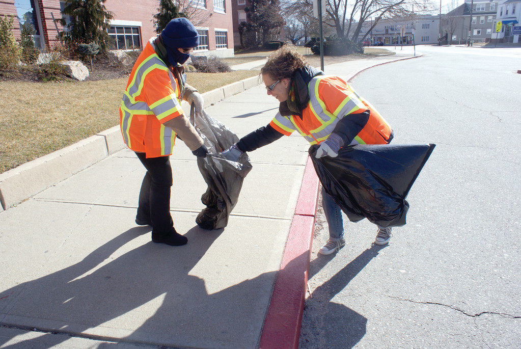 TEAMWORK: Working together, Tangie Miner and Debbie Fitman join a team of approximately 15 people who worked this past Sunday to clean up Park Avenue and the surrounding area as part of the Adopt-A-Highway program.