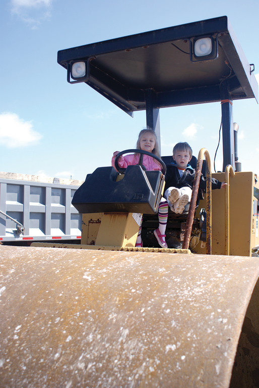 STEAMING AHEAD: Mia Caranci, age 4, and her brother Nicholas, age 1, check out a steamroller that came from Cullion Concrete.