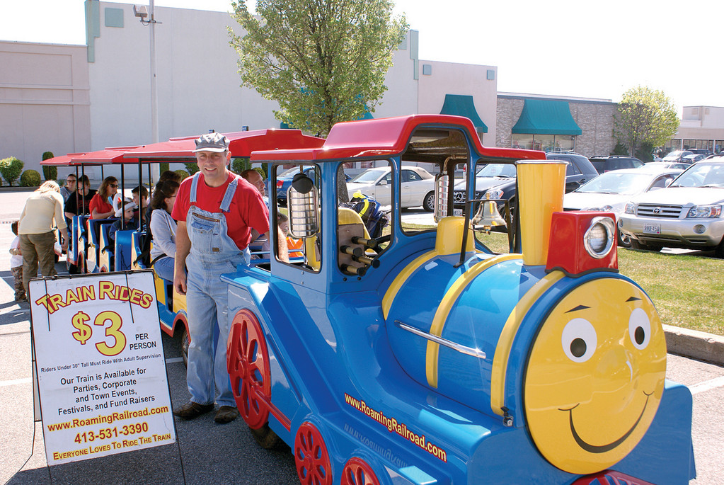 ALL ABOARD: Children of all ages enjoy rides on the Roaming Railroad, courtesy of engineer Dan DeCosmo.