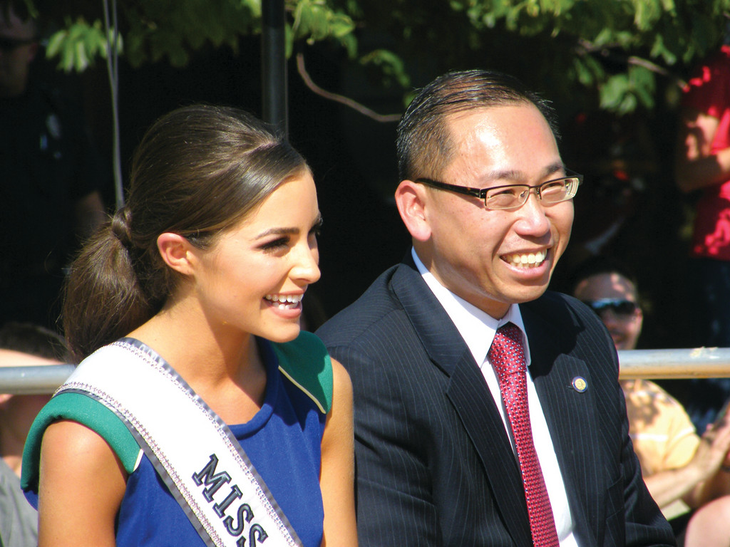 BIG SMILES: Olivia Culpo, Miss USA, shares a smile with Mayor Allan Fung during Friday’s celebration at  Cranston City Hall.