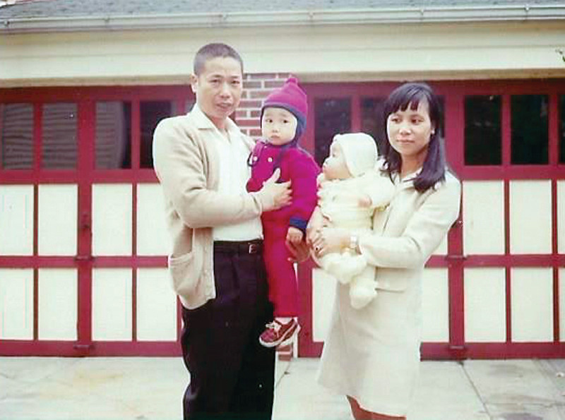 IN THE BEGINNING: Mayor Allan Fung (in red) was the oldest son of Chinese immigrants Kwong Wen and Tan Ping. He was the older brother to sisters Anna (pictured) and Arlene.