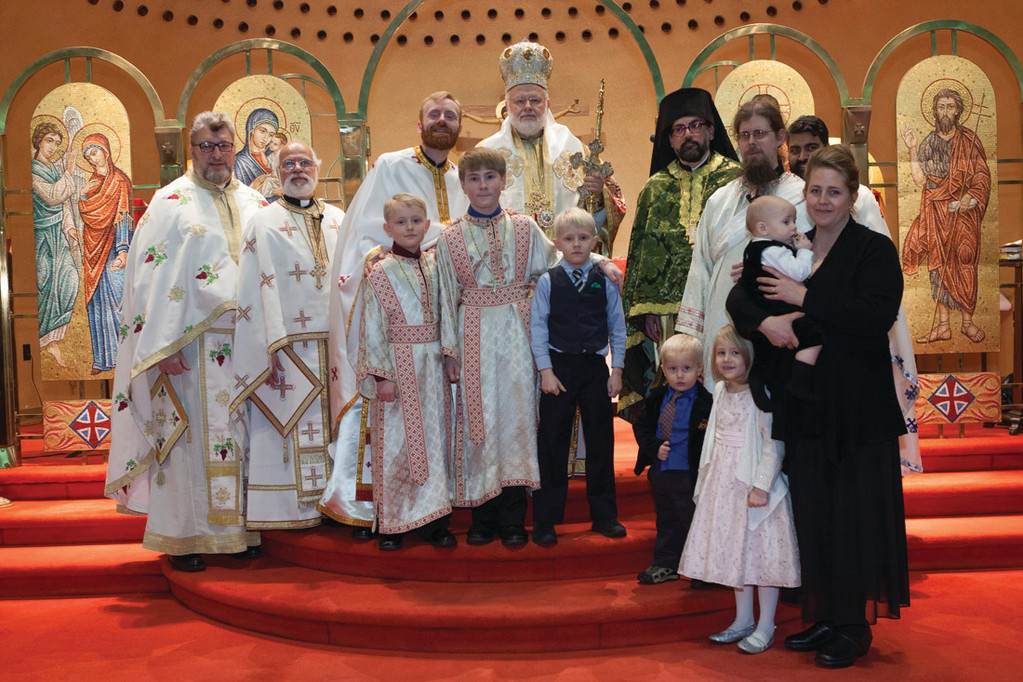 TRAGIC LOSS: Clergy and family members gather during Matthew Baker’s ordination at Cranston’s Church of the Annunciation in this January 2014 photo.
