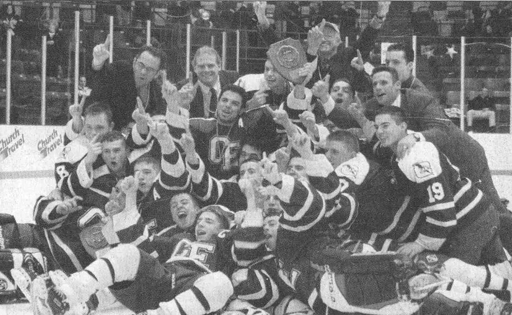 FINAL CHAMPS: The 2002 Cranston East hockey team poses with its trophy after winning the Met C championship. It was the last championship in Cranston East hockey history.