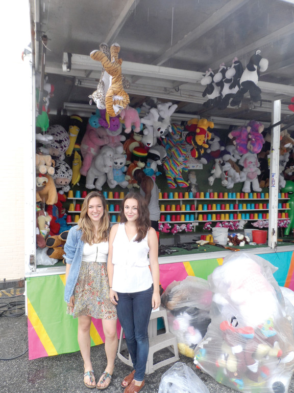 COMING HOME: Pictured are Aly Migliori, the creative force behind “Knightsville,” and Amanda Ebert, the lead actress who plays the role of Sara in the film, at the Saint Mary’s Feast grounds while vendors and others set up their booths.