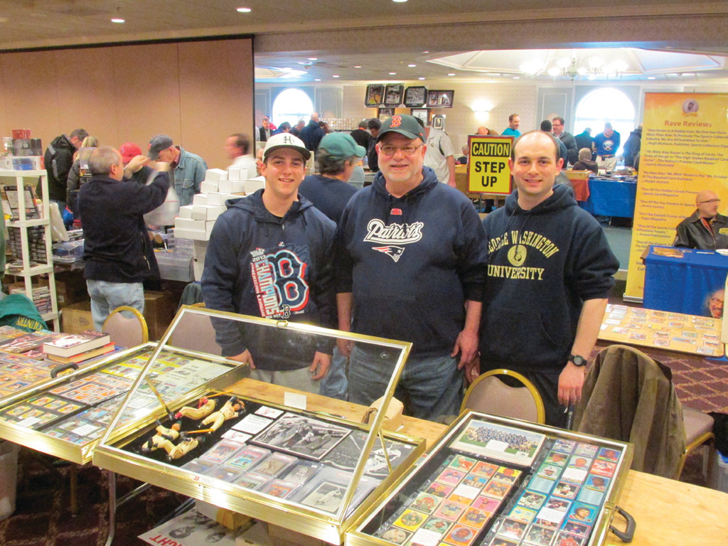 FAMILY OPERATION: Mike MacDonald, center, who owns Sports Heroes memorabilia store at 661 Oaklawn Ave. in Cranston, and his sons will set up shop at West Valley Inn in West Warwick for the 39th annual Cranston Sports Collectors Show.