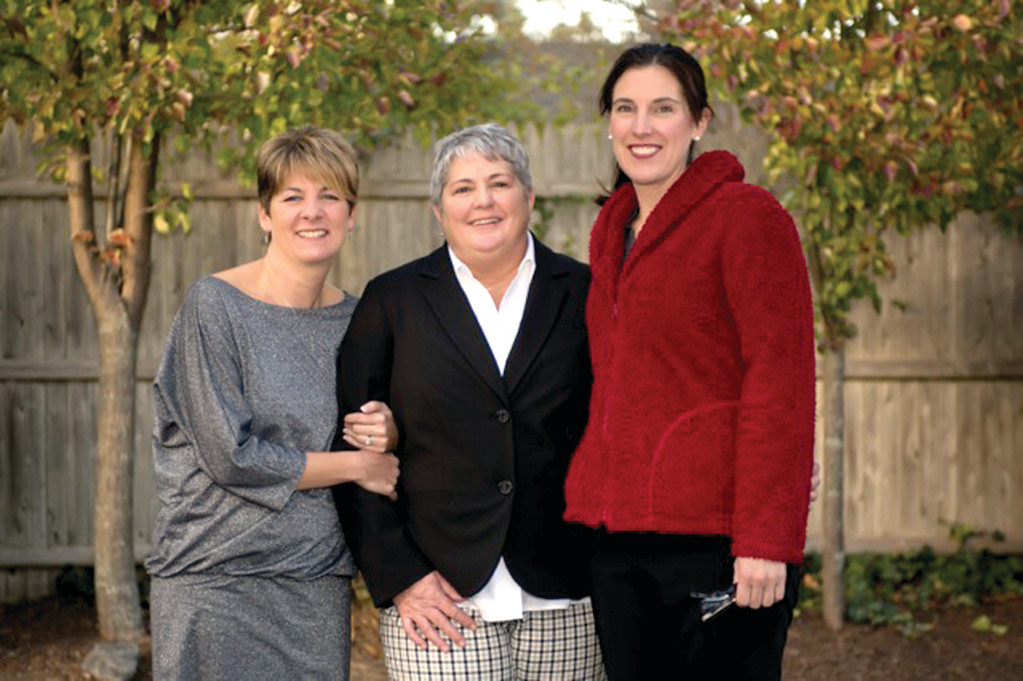 IT’S ALL ABOUT LOVE: Newlyweds Rosanne Rebello and Claudia Lavalle are seen with the Rev. Deborah Faith in Warwick on their wedding day, Nov. 23, 2014.