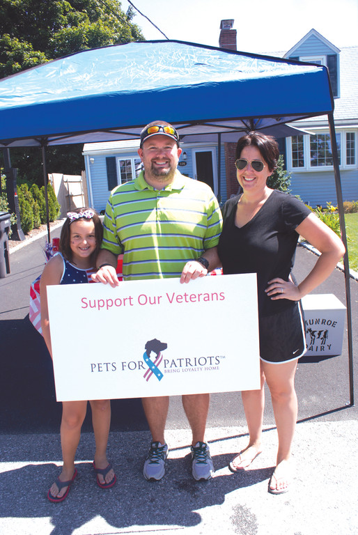 FAMILY MATTERS: It was through parental support that Oliva VanPatten held a successful Lemonade Stand on July 3. Pictured with Oliva are her dad, Bryn, and her mom, Liz.