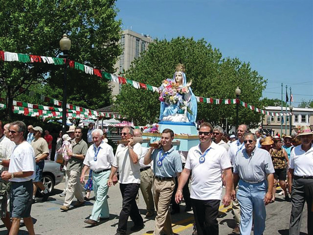 A MAJOR MILESTONE: The 100th anniversary St. Mary’s Feast parade passes the gazebo in 2005.
