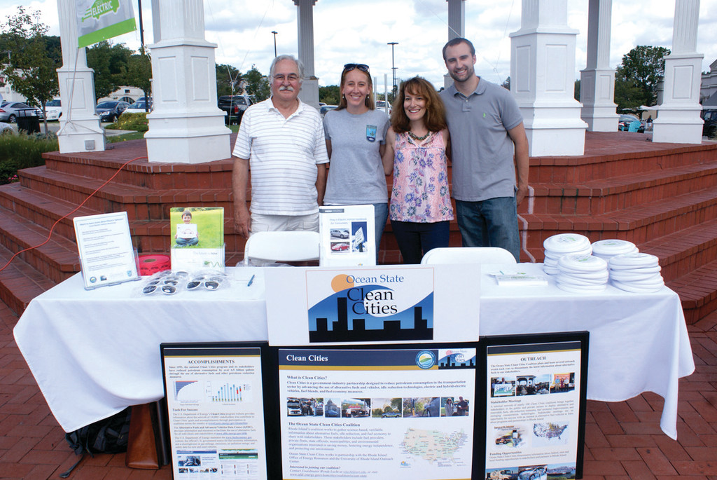 INFORMATION: Pictured at the information table at the National Drive Electric Week celebration in Garden City on Sept. 12 are organizers from Ocean State Clean Cities, including Frank Stevenson and Allison Callahan of DEM, Wendy Lucht of Ocean State Clean Cites, and Ryan Cote of the Office of Energy Resources.