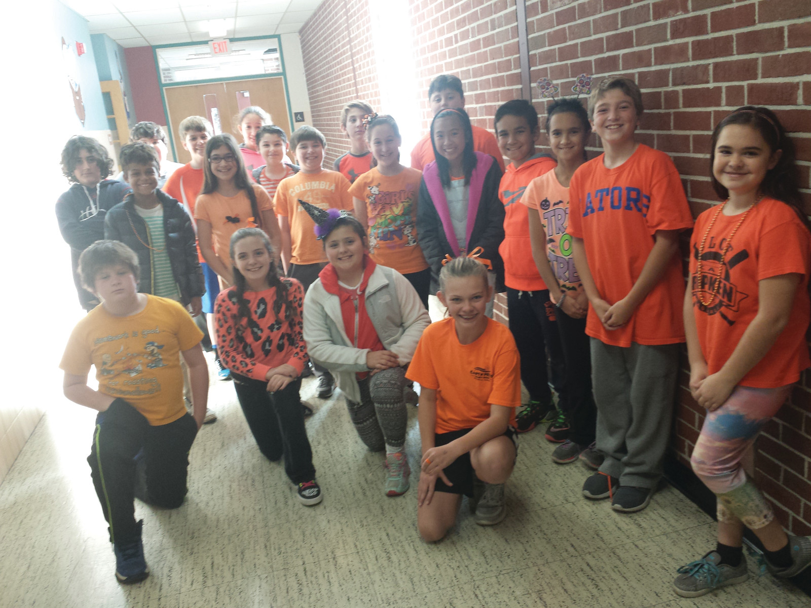 ONE OF THE FOUNDERS: Alexandra Cowart, one of the co-founders of Cranston’s annual Go Orange event, poses with her fifth-grade class on Oct. 30 as part of the Glen Hills Go Orange event.