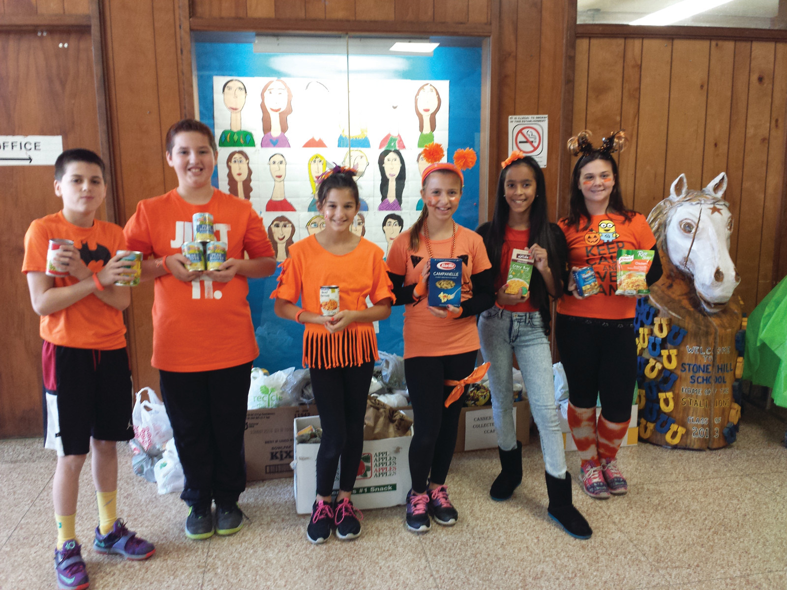GOING ORANGE: Stone Hill Elementary School’s sixth-graders took on the “Go Orange” event for their school, selling orange bracelets and stickers in order to increase their donations for this year’s drive.