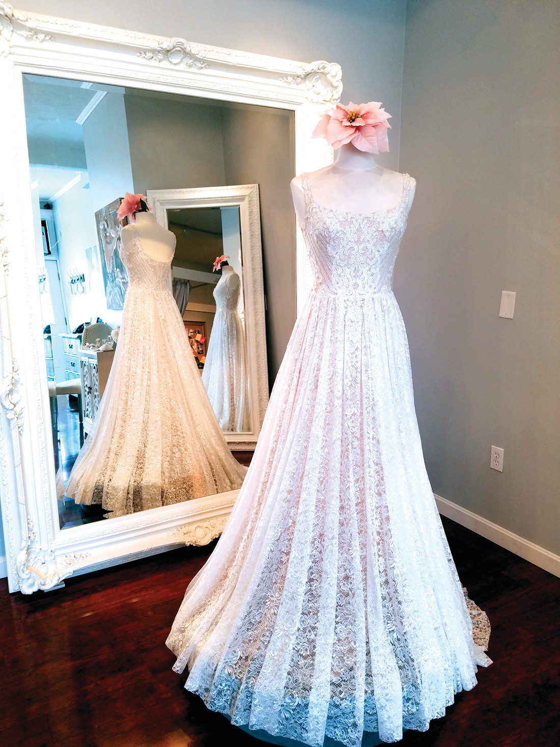 COMFORT FOR THE BRIDE: Spark Bridal Outlet on Cranston Street carries a 2017 Oksana Mukha design, a soft, flowing, and comfortable gown created from an ivory lace with a sheer cappuccino-colored underlay.