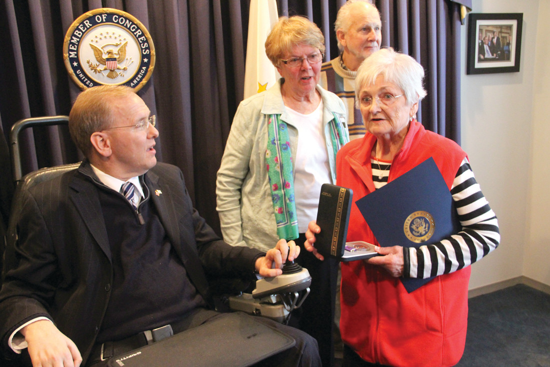 SECOND PURPLE HEART: Congressman Jim Langevin presents Mrs. Carol Liebrich with her late husband’s second Purple Heart.