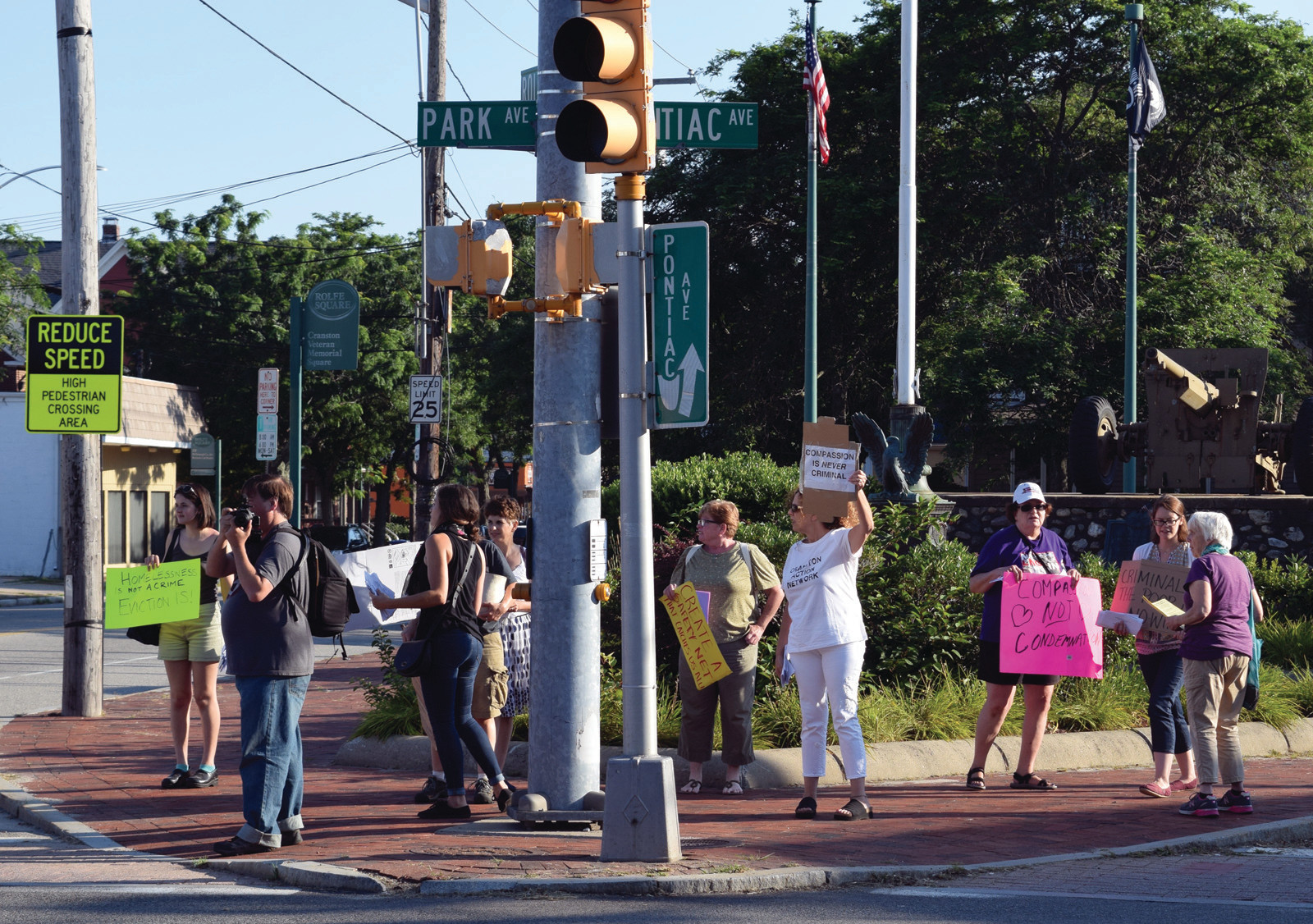 AT A CROSSROADS: Protesters gathered at the intersection of Pontiac Avenue, Park Avenue and Rolfe Square to speak out against the Cranston panhandling ordinance.