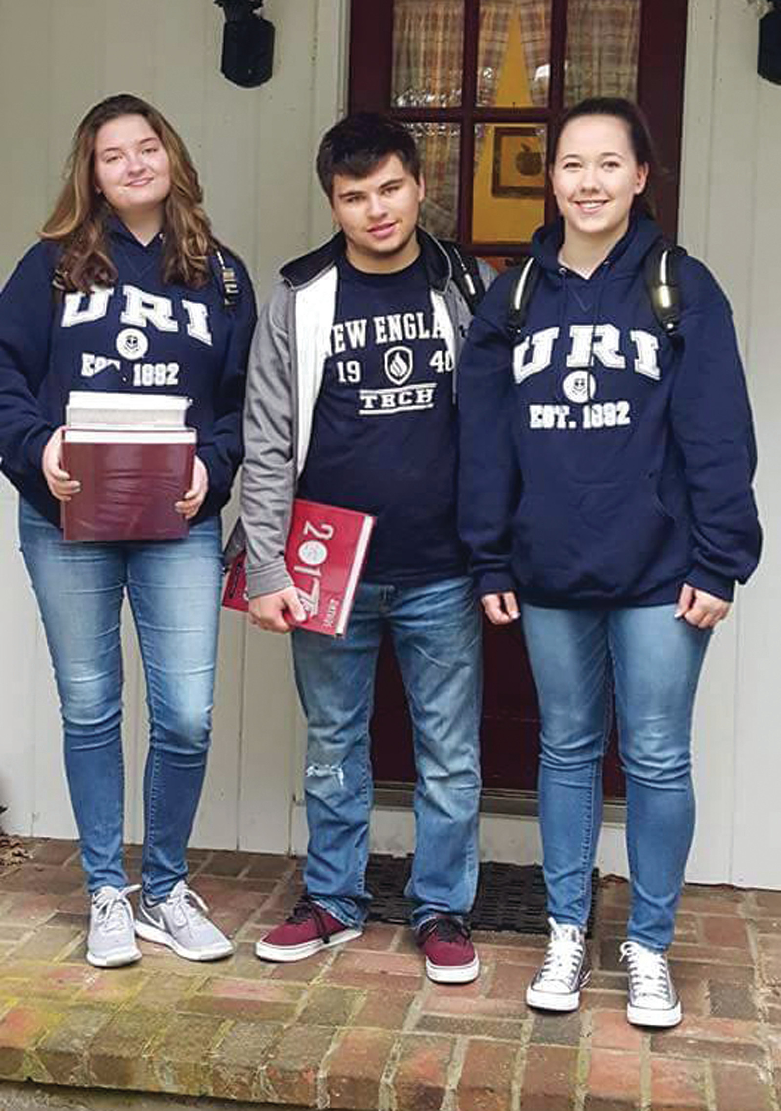 SCHOOL SHIRT DAY AT CHSW: During the final week of school at Cranston High School West, one of the many celebratory days is one on which the seniors can proudly show off the school they will be attending by wearing a shirt or sweatshirt with the school name on it. Here, Ryan, Jordan and Allison show their school spirit for New England Tech and the University of Rhode Island.