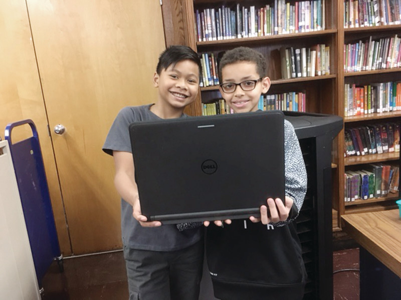 DELL-VING INTO CODE: Gladstone 4th graders are all smiles after their Minecraft coding victory.