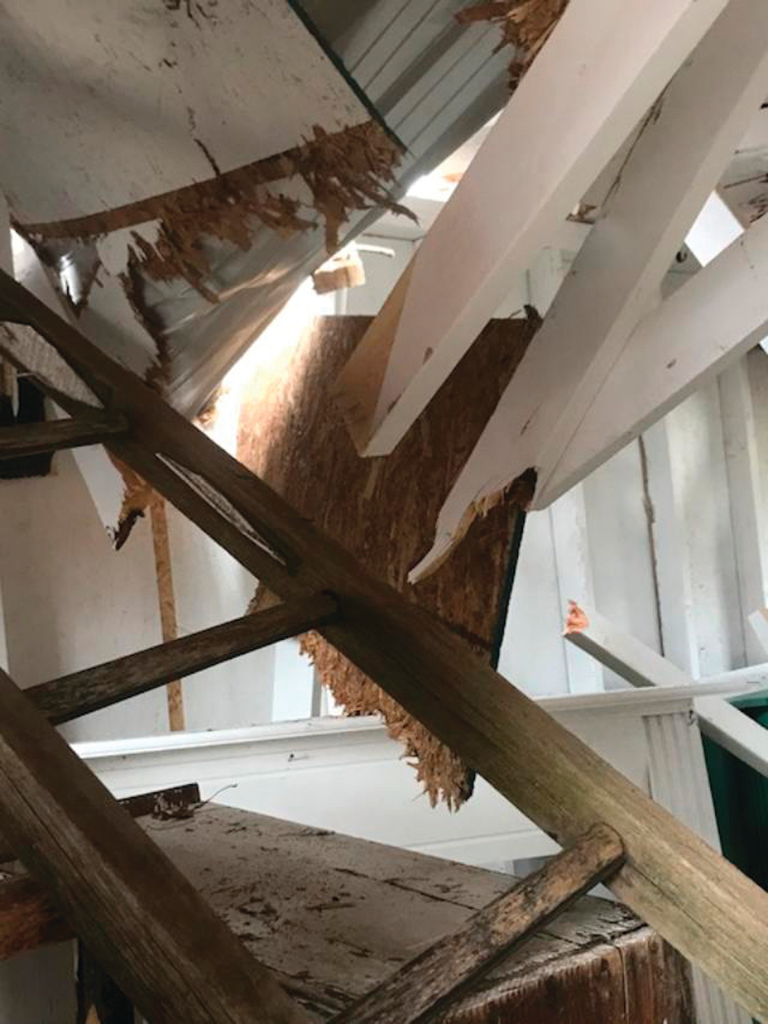 RIGHT THROUGH THE ROOF: The damage included the inside of the shed where all of Abbey’s wares had been on display for her customers. Family and friends helped to empty the shed.