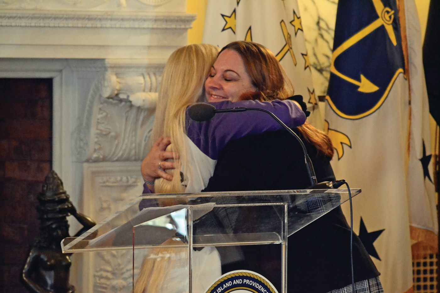 LIKE MOTHER LIKE DAUGHTER: Mary and Tara Townsend embrace after Mary introduced Tara as a caregiver of the year at the Rhode Island Statehouse. Tara said she could never have been as strong in caring for her disabled son without her mother’s love and support.