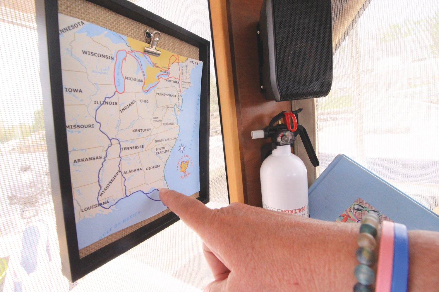THAT’S THE PLAN: A framed map serves as a reminder of the 6,000-mile loop Rick and Marie plan to complete in their 28-foot “pocket yacht.”