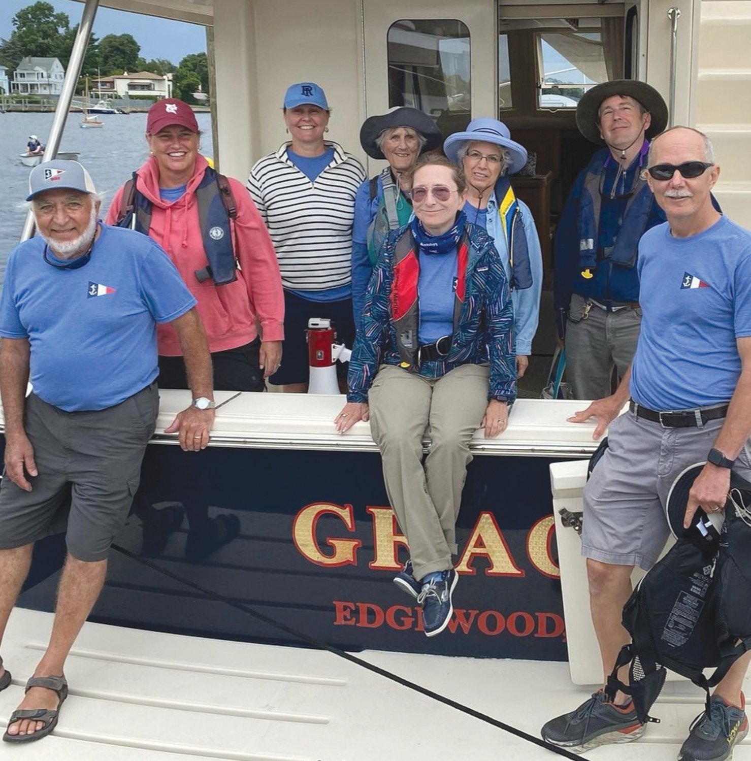 REGATTA TEAM: Pictured on the transom of the Champion Fleet race committee boat are Paul Thomas, Kirsten Small, Donna Fraser, Anne Pearson, Catherine White, Betty Paroli, Stuart Malone, and Principal Race Officer for the RWB/Championship Fleet Chris Lee.