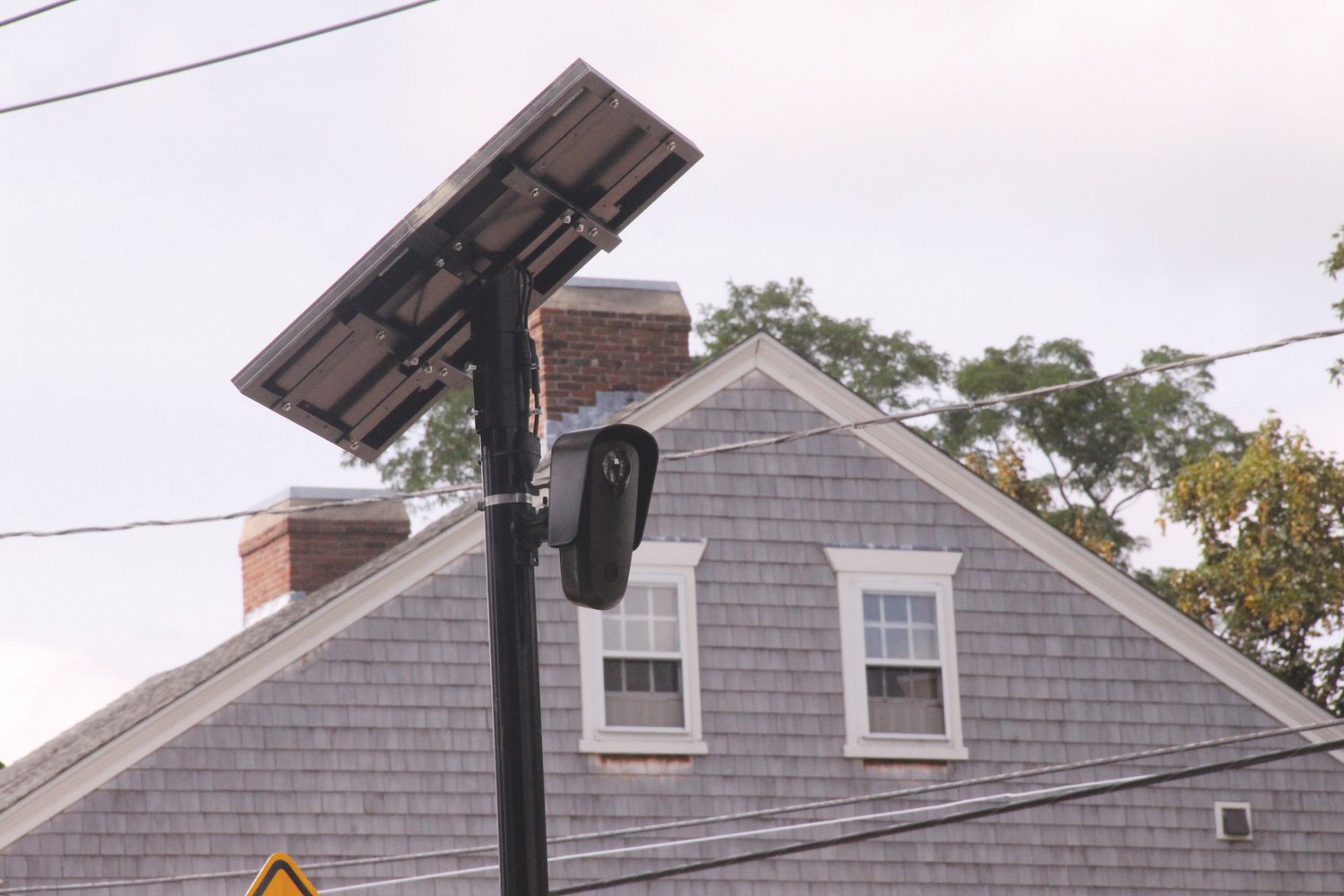 KEEPING AN EYE OUT: The license plate reading cameras from Flock Safety, like this one in Pawtuxet Village, were
the subject of Monday’s special City Council meeting. (Herald file photo)
