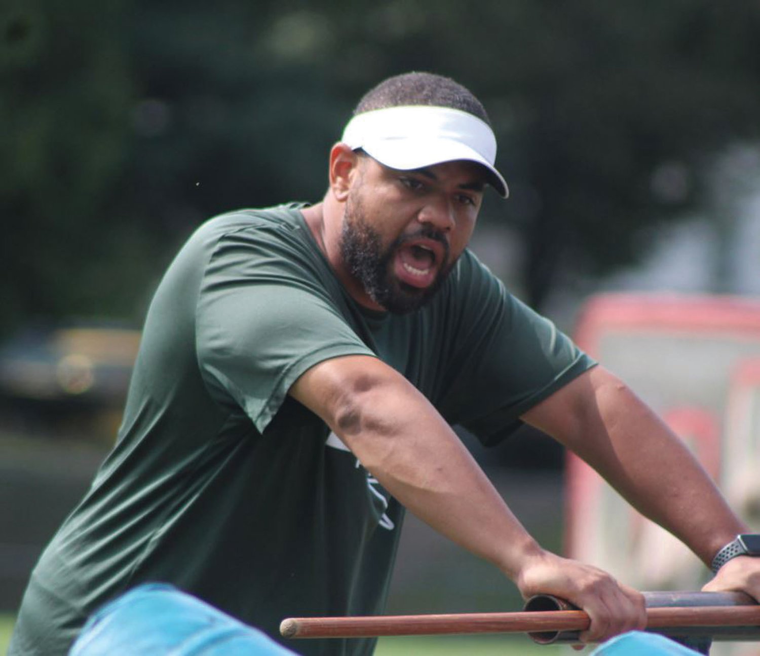 AT THE HELM: New
Cranston East head coach Isaiah McDaniel directs a drill at a recent practice.