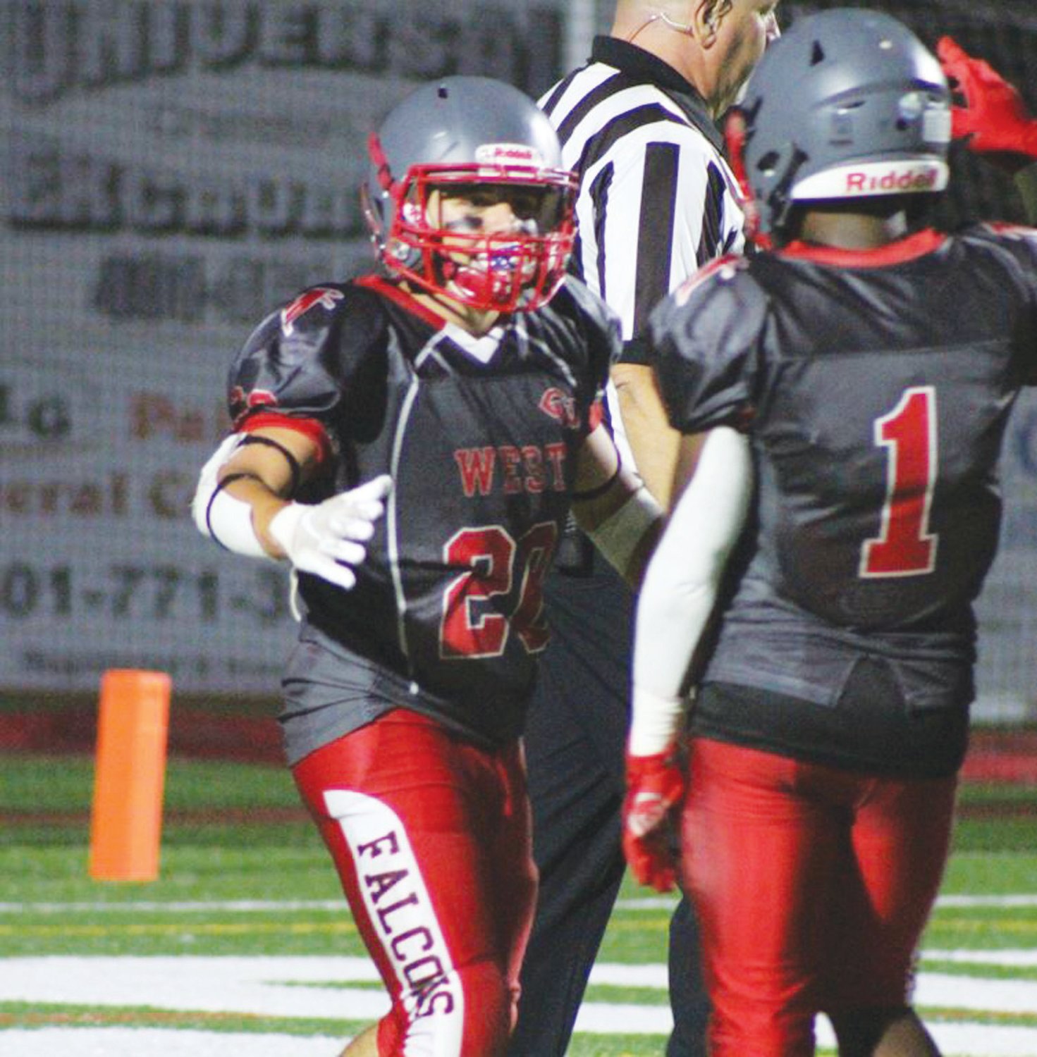 GETTING THE WIN: West’s Dimitri Leblanc (20) and Marcus Chung (1) celebrate.