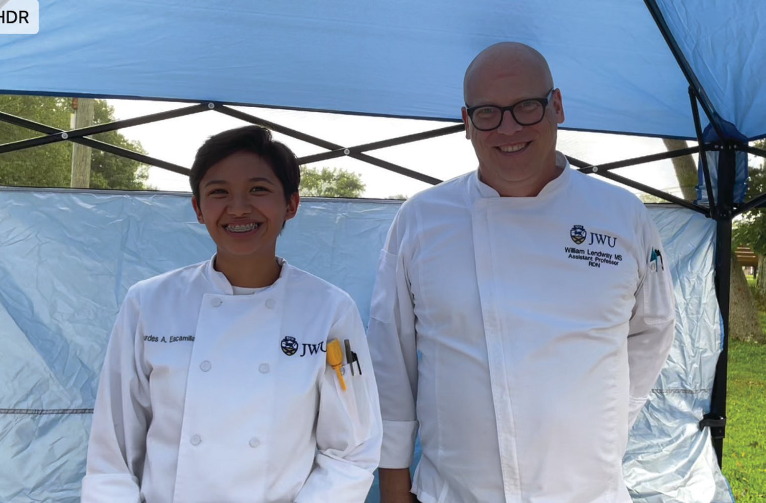 CHEFS KNOW BEST: Student Lourdes Escamila and chef William Lendway from Johnson & Wales University share their knowledge and skills with shoppers at the farmers market.