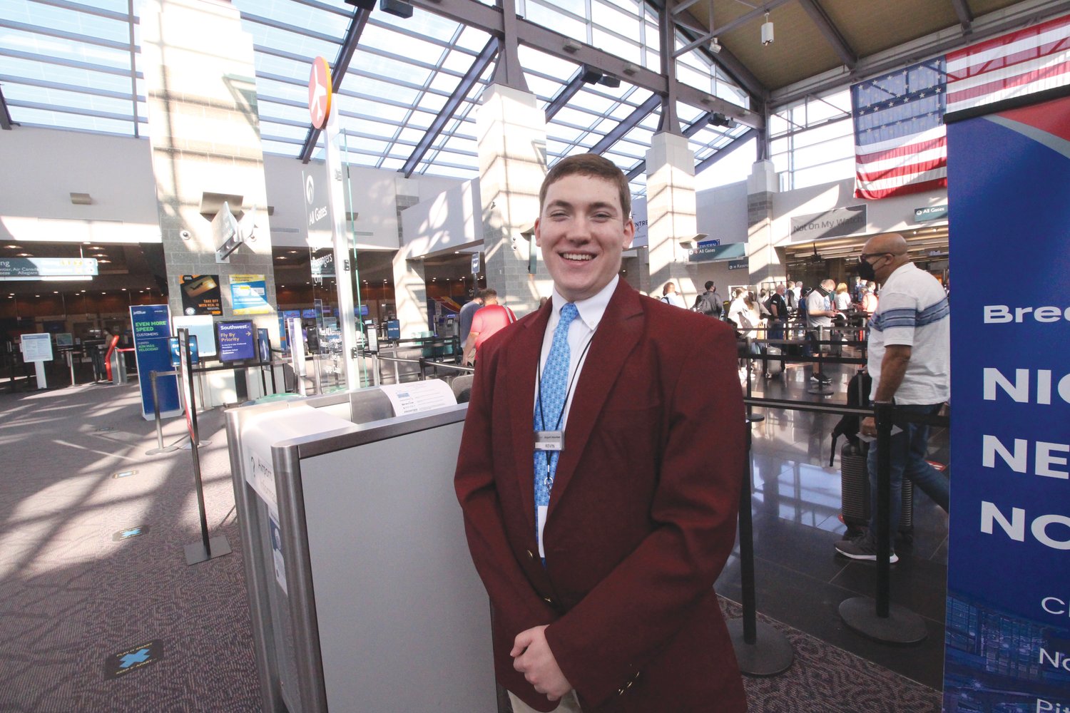 NO END OF QUESTIONS: Providence College sophomore Kevin Sawyer said days vary at the airport. Some days, he said, scores of different people are asking him the same question, whereas on other days the questions are all different.