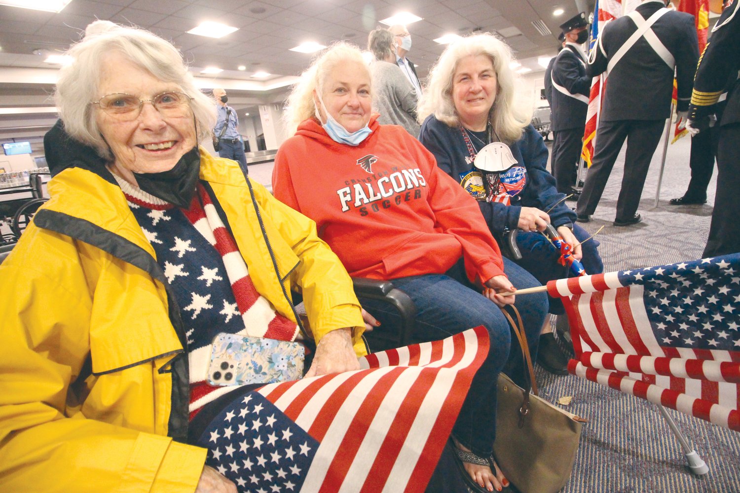 CHEERING SQUAD: Sandy Alling and her daughters
Judi Sherwood and Nancy Khanjari were among the
more than 150 people who turned out at Rhode Island
International Green Airport to send off Saturday’s Honor
Flight at 5:30 a.m. Sandy’s husband, Richard, served
in Vietnam and in the words of his daughters “we are
Army brats.” The Allings live in Cranston