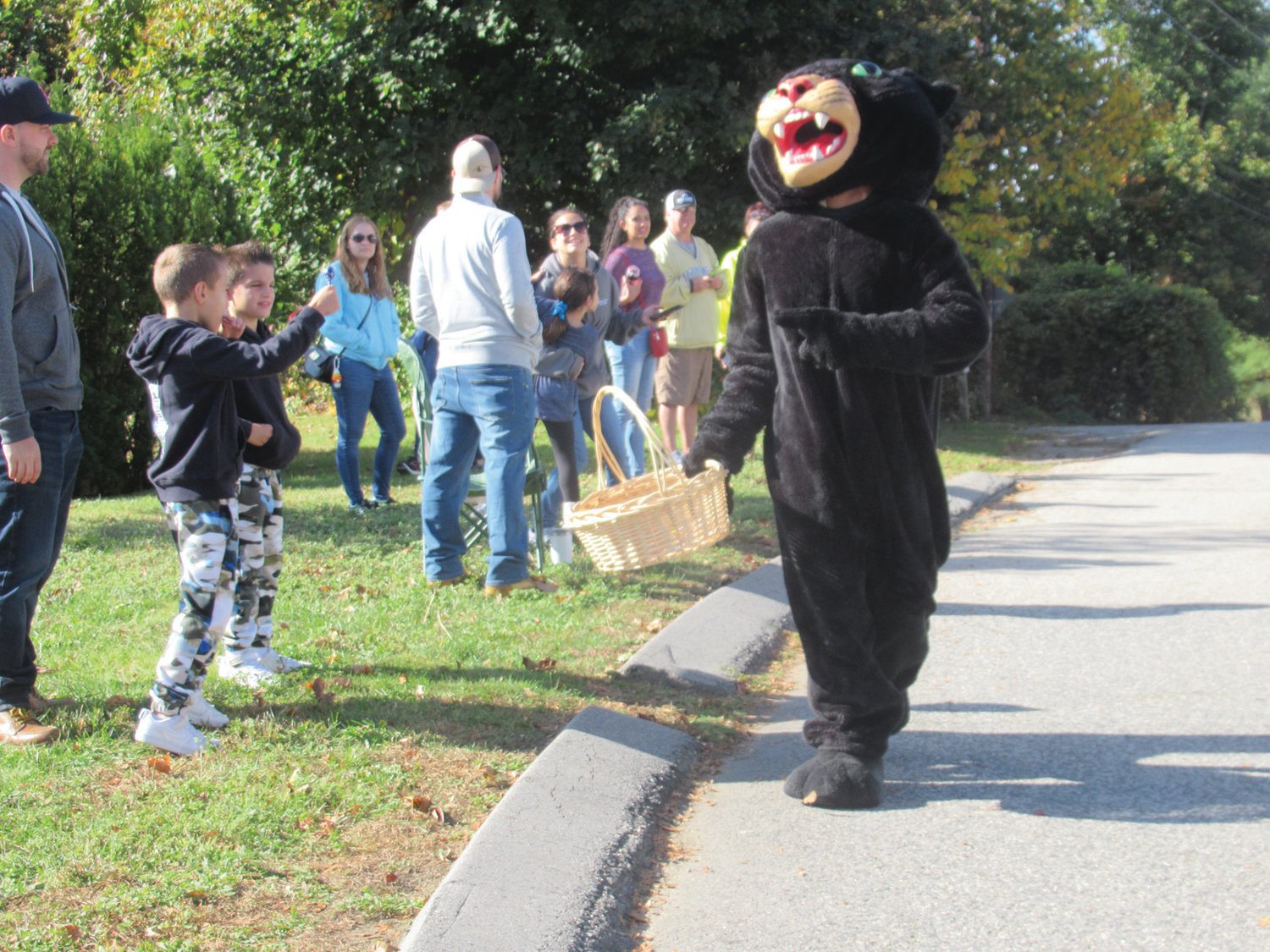 MIGHTY MASCOT: Johnston High’s Panther was a huge hit with young and old alike during the recent Homecoming Parade.