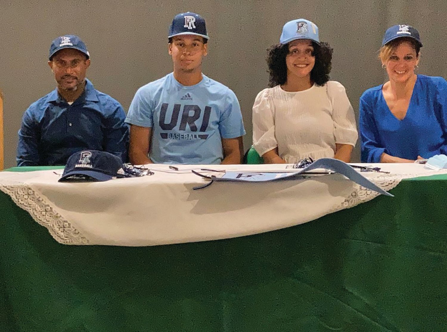 MAKING IT OFFICIAL: Cranston East’s Anthony Fernandez (second from left) signs his National Letter of Intent to
play baseball for Division I University of Rhode Island.