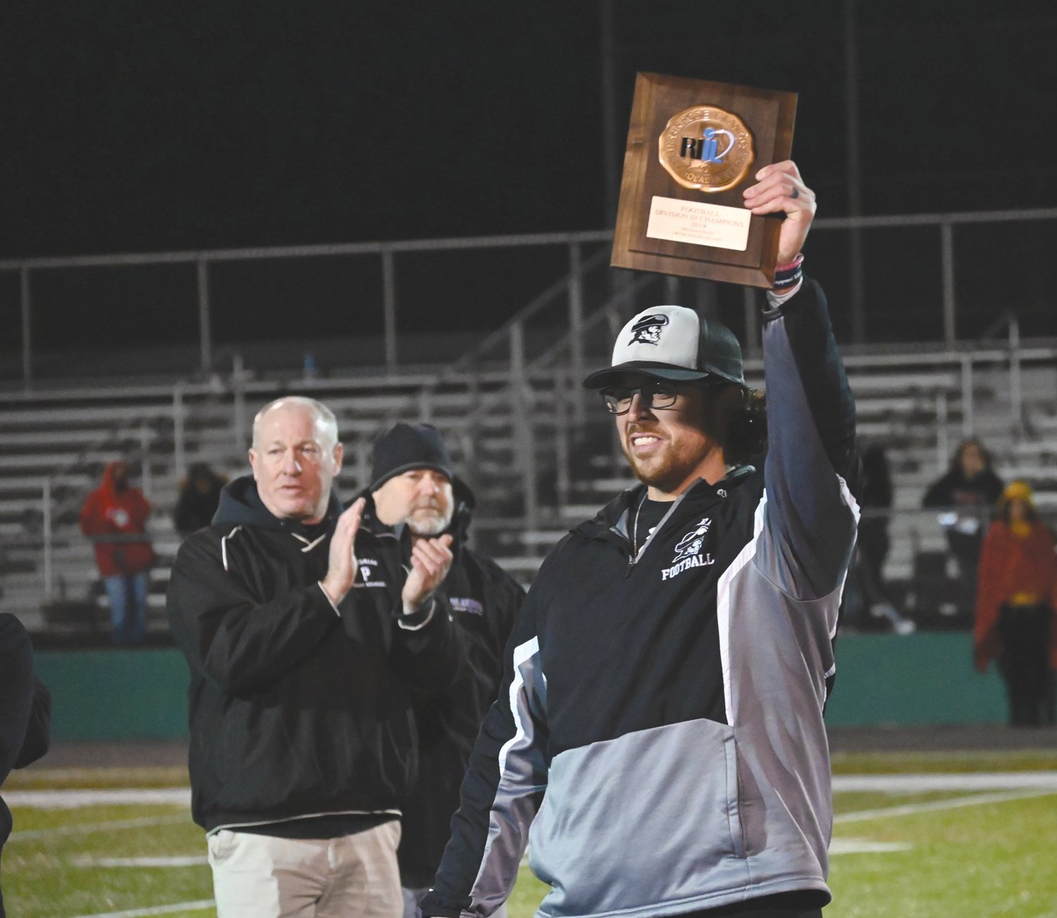 FULL CIRCLE: In the wake of Pilgrim High School Principal Gerald Habershaw’s death Pilgrim High School Head Football Coach Blake Simpson reflected on how 17 years after they first met at Aldrich Junior High Habershaw was able to be beside him as he lifted the High School Division III State Championship Trophy in 2019.