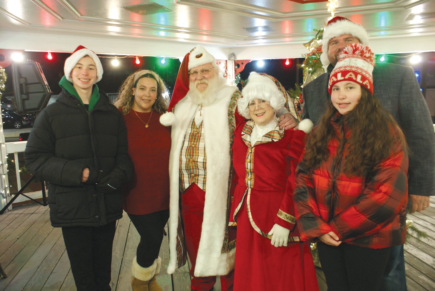FAMILY TRADITION: The Knightsville Tree and Gazebo, hosted
by City Council President Chris Paplauskas, has become a
family traditions. Enjoying some time with Mr. & Mrs. Claus is
the Paplauskas Family - Aidan, 14, Judy, Chris and Sophia, 12.