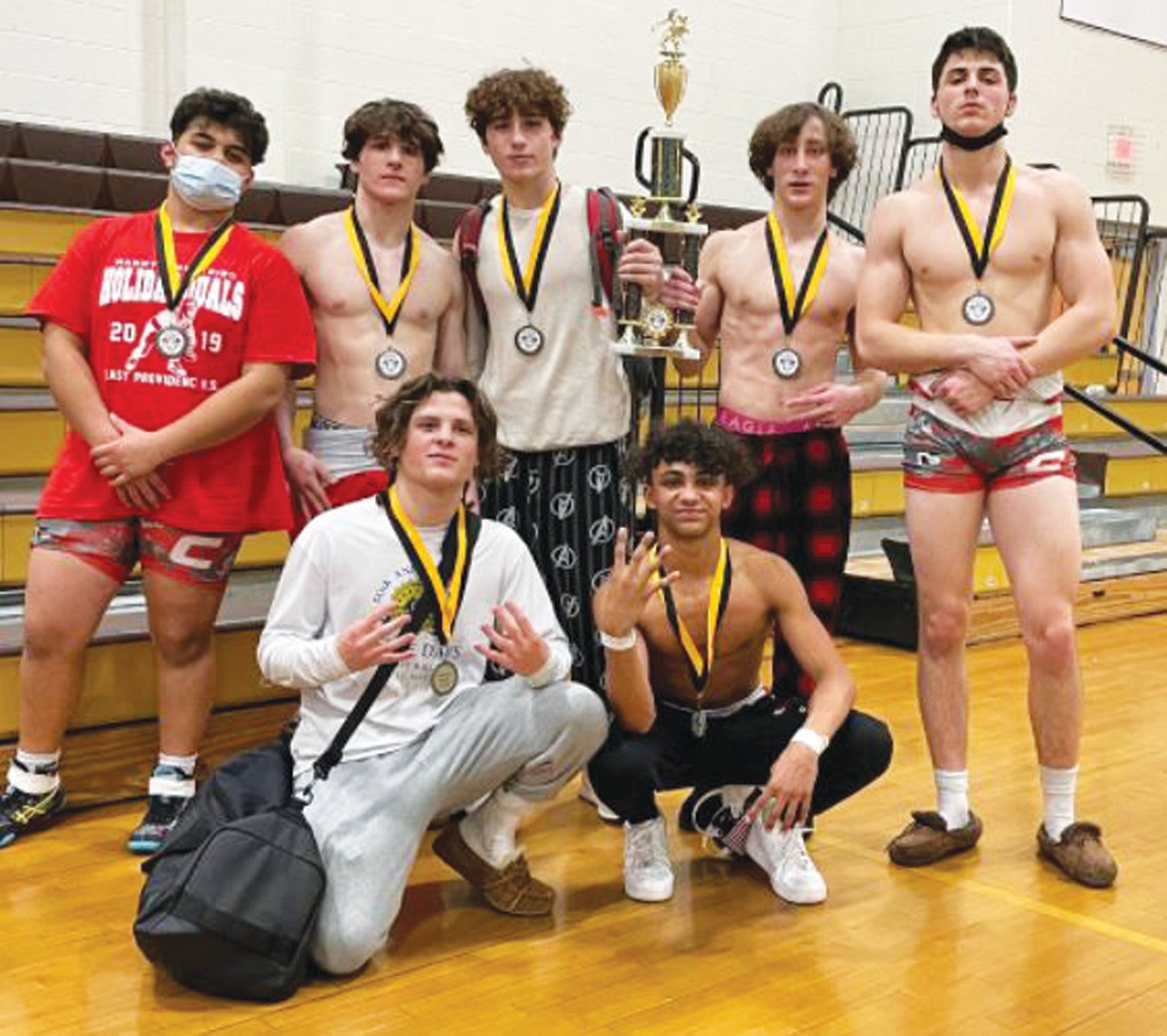 TOP OF THE PODIUM: West’s seven wrestlers who placed at the Wilson Cup.