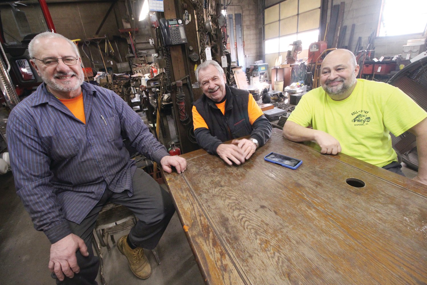 TEAMWORK: (Left to right) Larry Defreitas, Butch Guevremont and Ed Prosser are the three partners of Roll-A-Way Disposal. Butch’s brother, Ben, had been part of the company but left in the 90s.