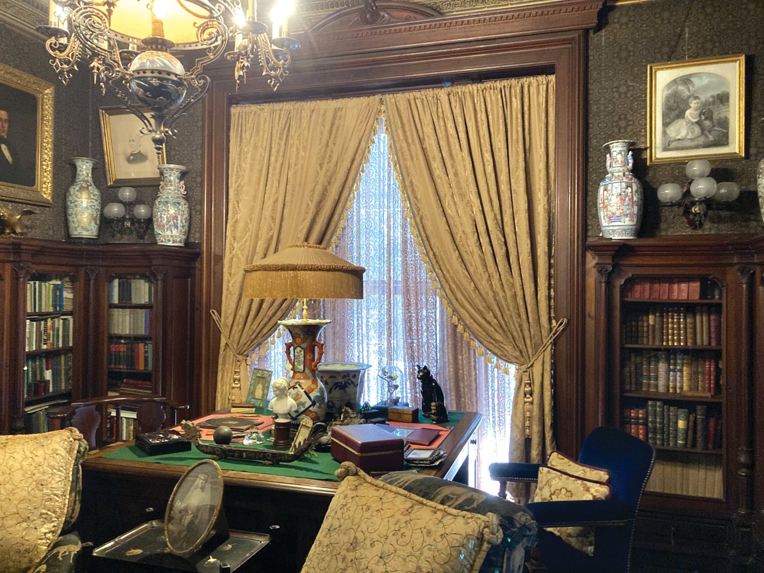 A LOOK INTO THE LIBRARY: For the filming, the library’s desk was removed from the set. The curtains in the background are new replacements provided by the crew.