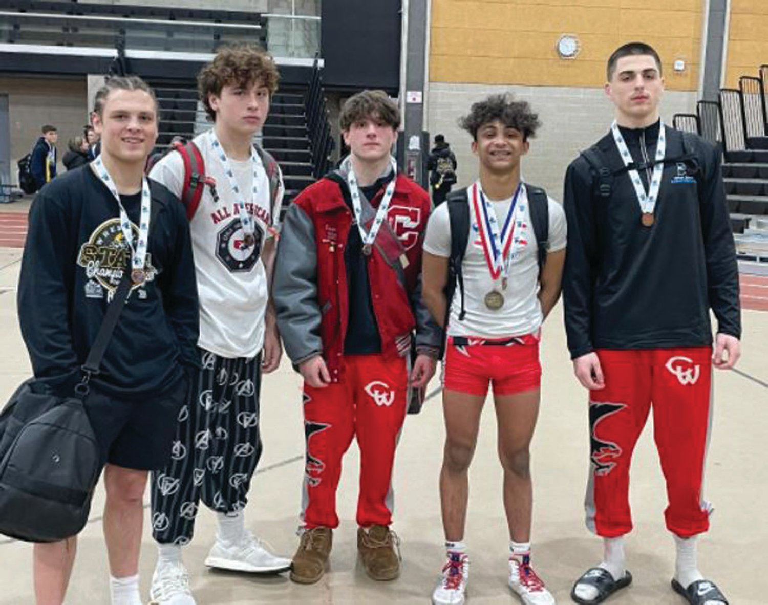 ALL-STATE: Pictured are Cranston West’s wrestlers that made it to the podium. From left: Luke Montefusco, Preston
Marchesseault, Landon Giampietro, Cam Davis and Noah Polion.