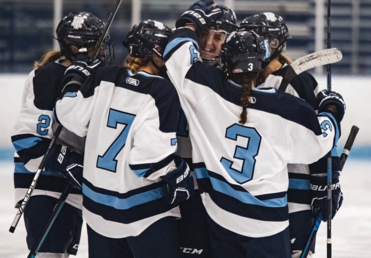STRONG FINISH: Members of the URI women’s hockey team celebrate after scoring a goal.