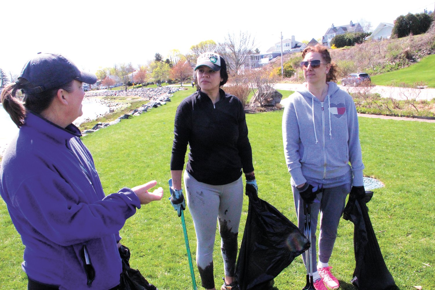 HELPING OUT: CD2 candidate Joy Fox (left), Councilwoman Lammis Vargas (middle) and Councilwoman Jessica Marino came to help cleanup Stillhouse Cove on Saturday.