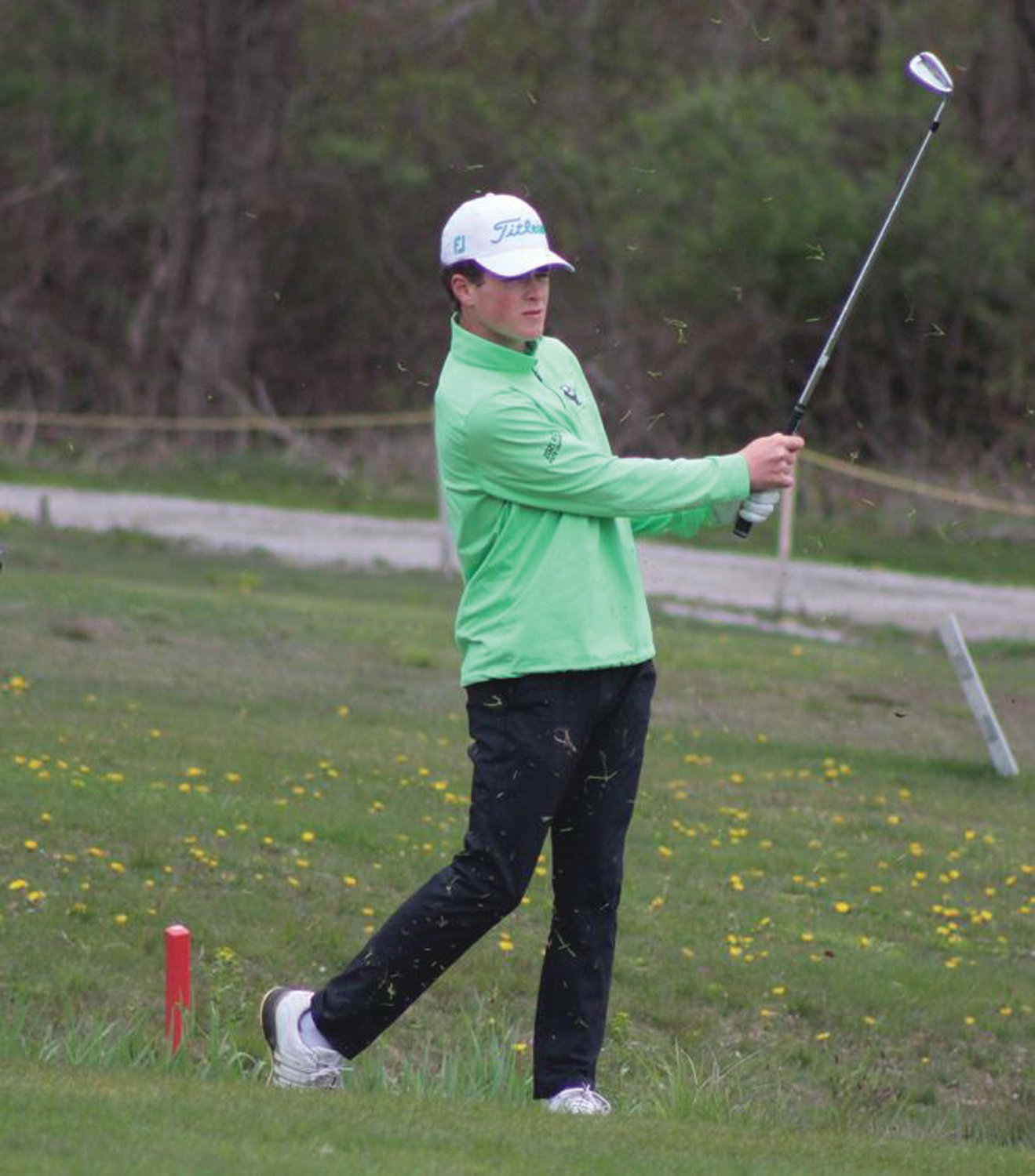 CHAMPIONSHIP READY: Bishop Hendricken’s Gianni Fontenault watches a shot down the fairway in a match earlier this spring.
