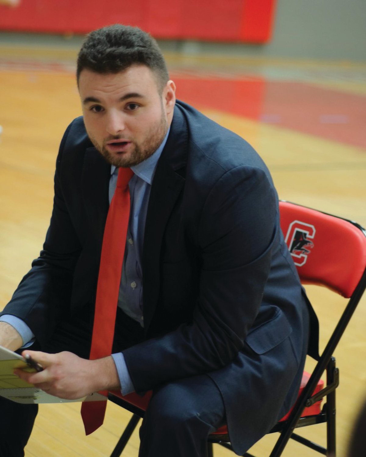 STAYING HOME: Cranston West’s James Sweeney during last year’s basketball season. The former Falcons junior varsity coach was recently elevated to the varsity program. (Submitted photo)