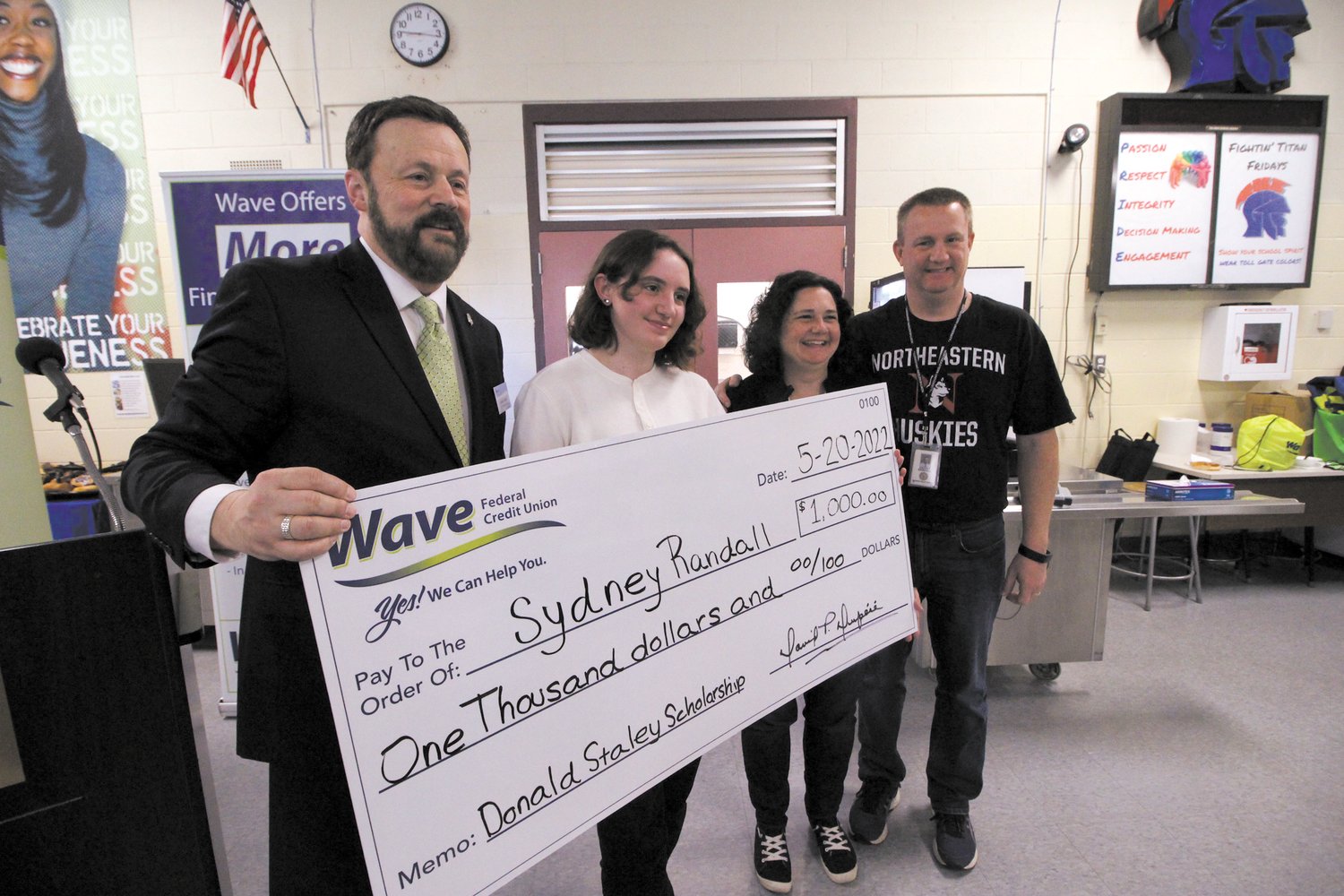 SCHOLARSHIP RECIPIENT: David Dupéré, President, and CEO of Wave Federal Credit Union is joined by Randall family members Sydney, her mother Jennifer and father Keith for the presentation of the Donald Staley scholarship to Sydney. (Warwick Beacon photos)