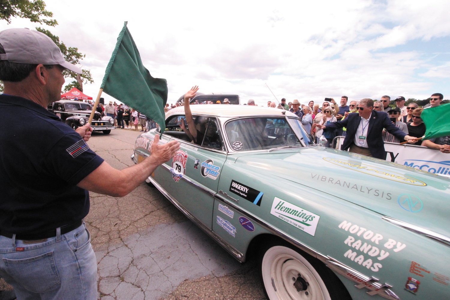 on to fargo: Mayor Frank Picozzi waves the beginning of the Great Race for a Hudson Hornet which he considers to be “greatest car ever manufactured.”