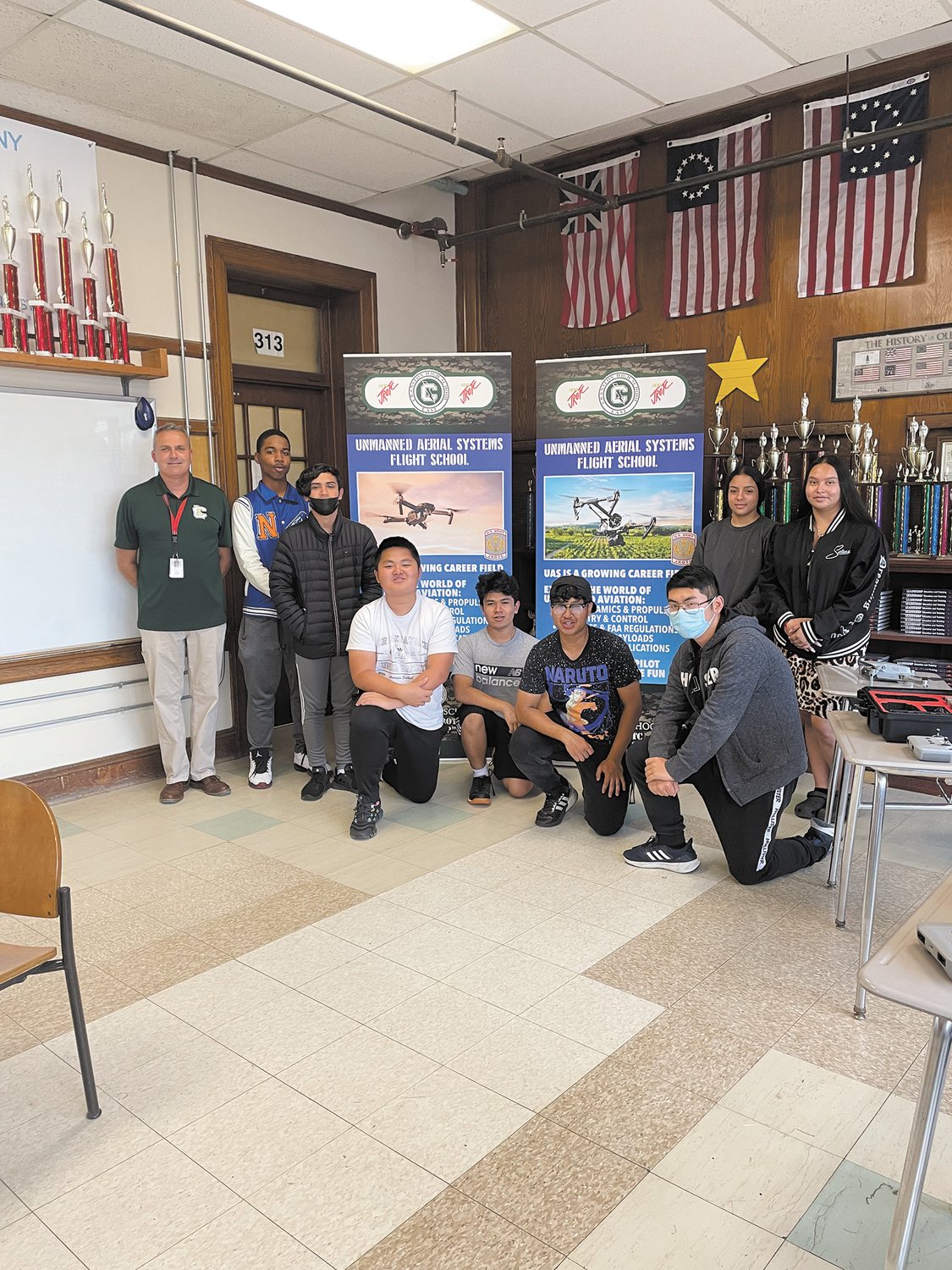 FLYING HIGH WITH THEIR DRONE LICENSES: Some of the cadets who completed the Unmanned Aerial Flight School include Alexis Franco, Cristy Juarev, Adrian Roslales, Buntha Chur, Danny Song, Jefferson Shi, Jonathan Quiroa, Ray Melendez Montera, along with instructor Moise Moniz Sgt. Major (ret) U.S. Army.