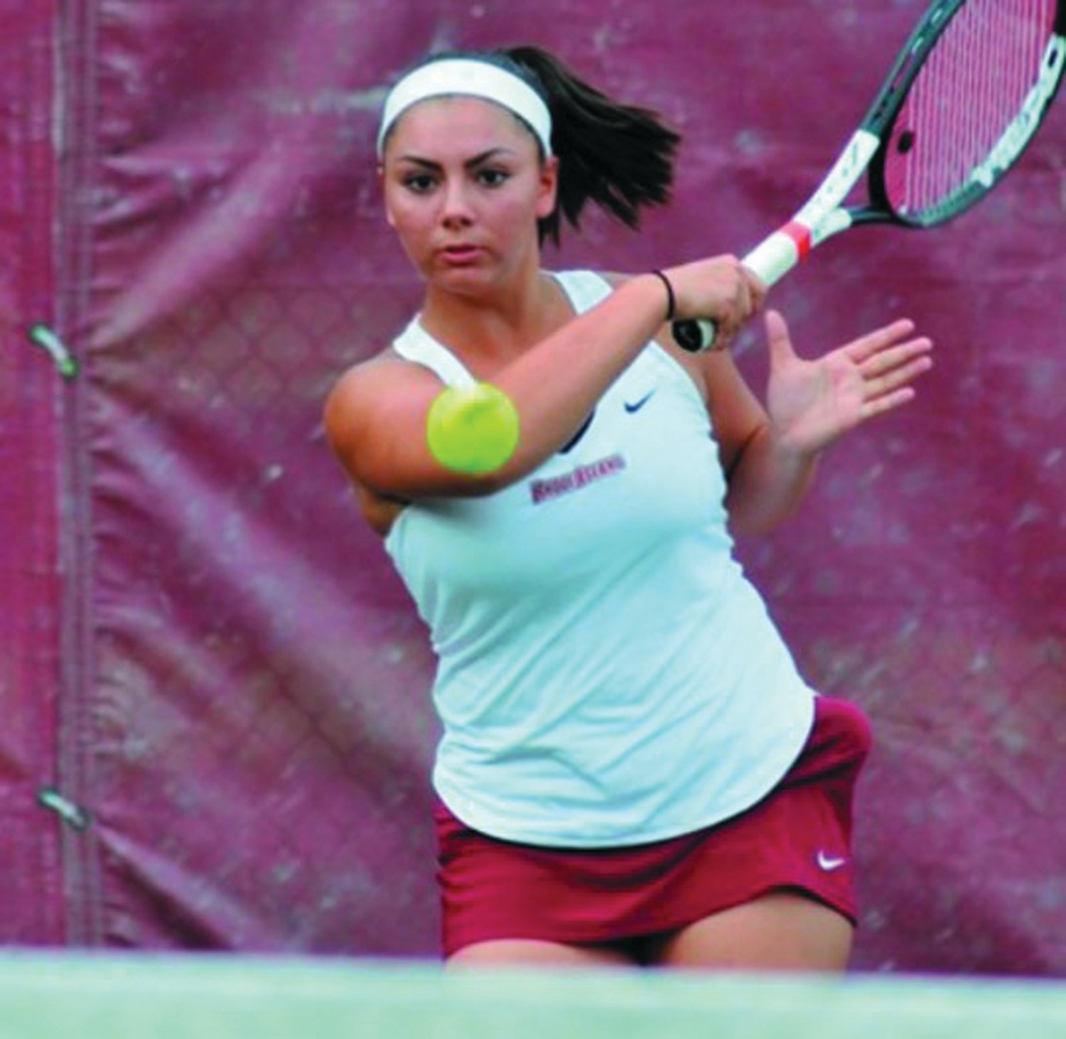 RETURN SHOT: Jenna Lisi returns a shot for RIC in this file photo. Lisi was named the Jill Craybas Award winner for the third straight year, which recognizes the state’s top female college tennis player.