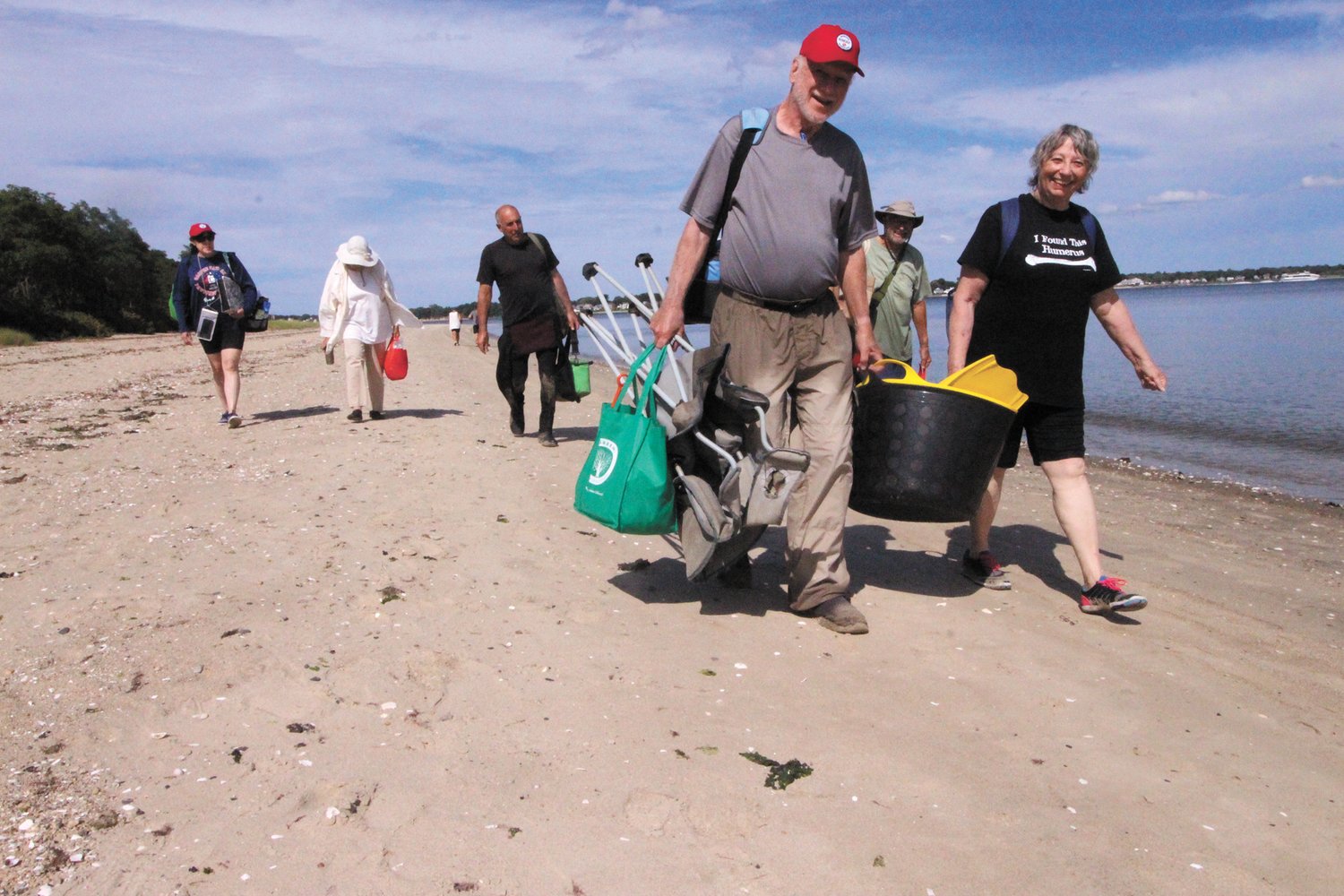 PACKING UP: Volunteers in the search for the Gaspee head for their cars after a day of collecting measurements and doing a survey of Gaspee Point and the immediate shallows. (Warwick Beacon photo)