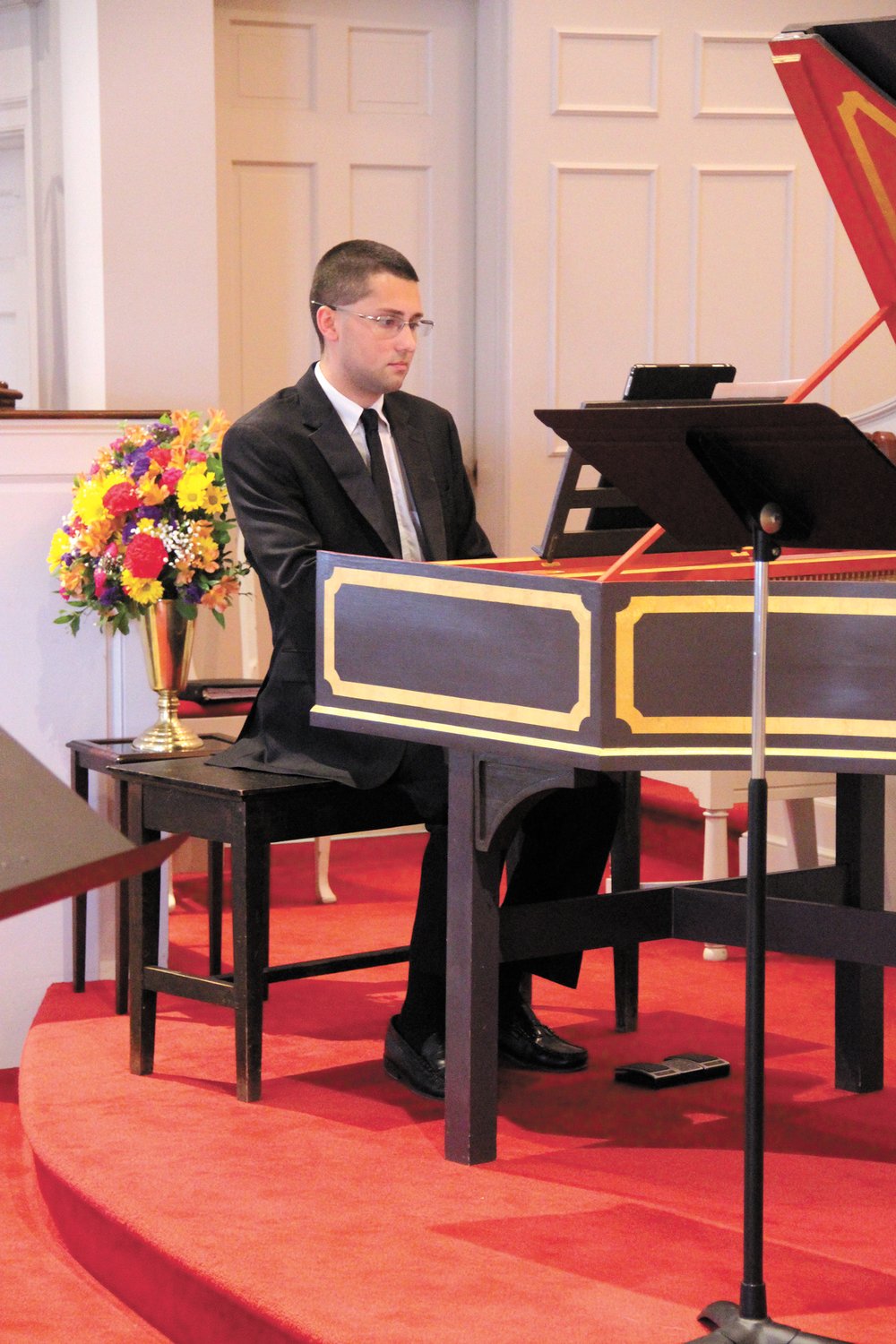 AT THE KEYBOARD: John Black, director of music at Greenwood Community Church, organized the dedication recital and played the harpsicord.