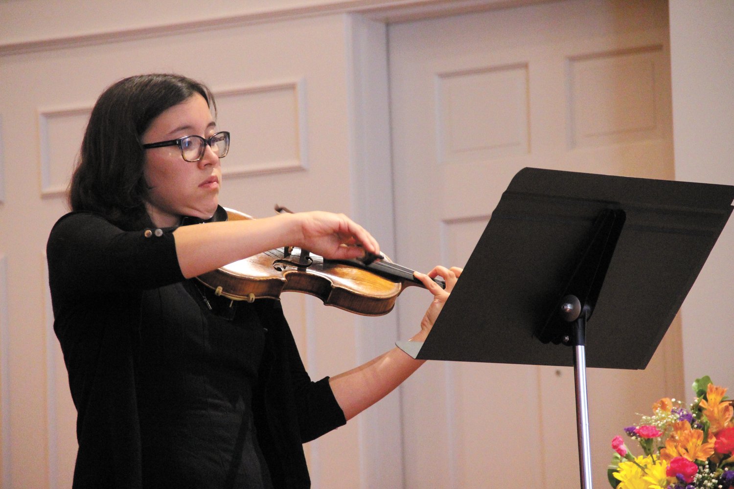 ON THE STRINGS: Alexandra Nichols, the church's music associate, played the violin as well as a Bach toccata on the harpsicord.